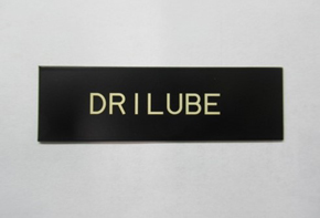 Laser marking on black film with base coating using a white film for improved coloration
